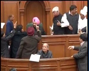 MLAs surrounding speaker in Delhi Assembly 