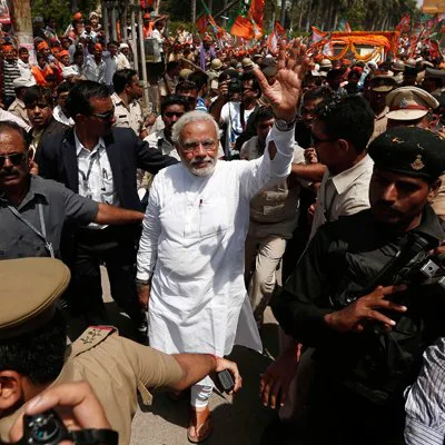 Narendra Modi surrounded by security and fans