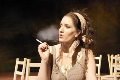 Fiona Harrison vaping or e-smoking on stage of Carmen at a Welsh National Opera production in Swansea, South Wales