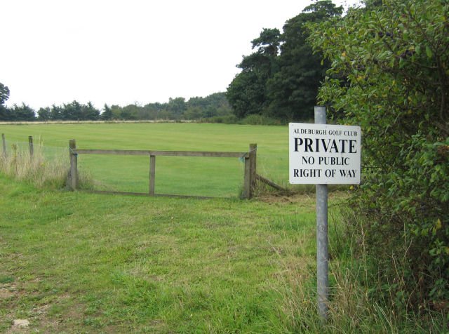 A do not disturb sign at a Gol Course emphasizing private property