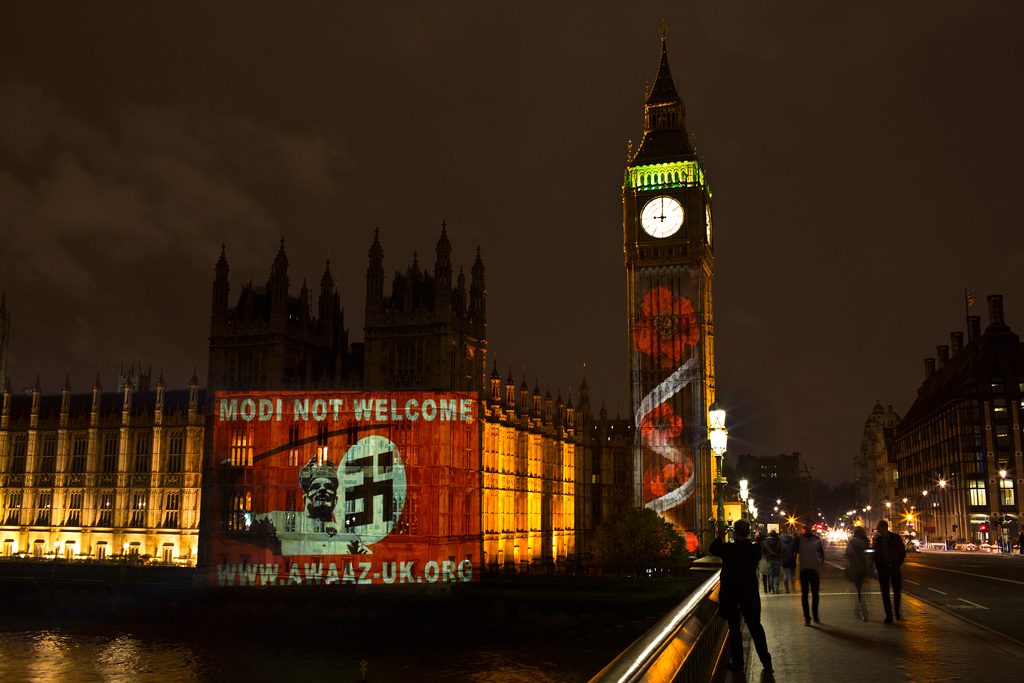 ModiNotWelcome Awaaz Netowrk campaign projected this poster on the UK Parliament