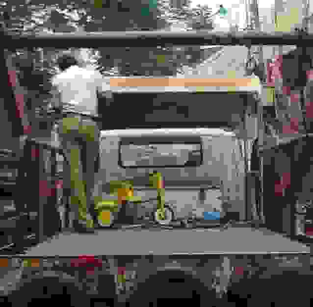 tricyce in the back of a traffic police pick up